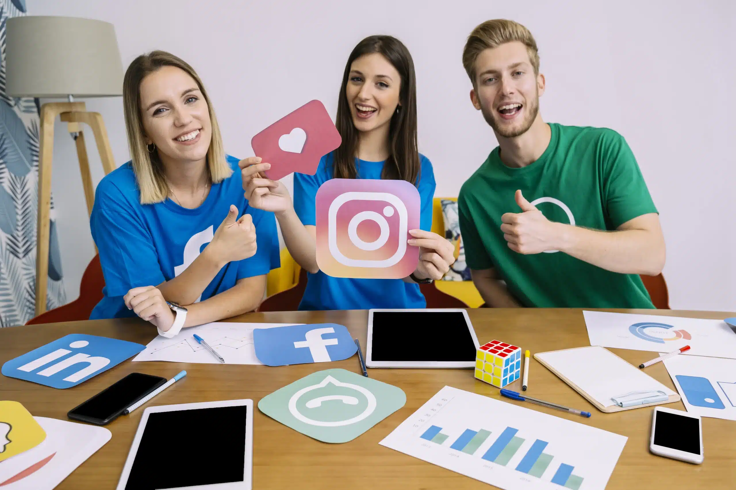 woman holding snapchat logo with his friends showing thumbup sign scaled